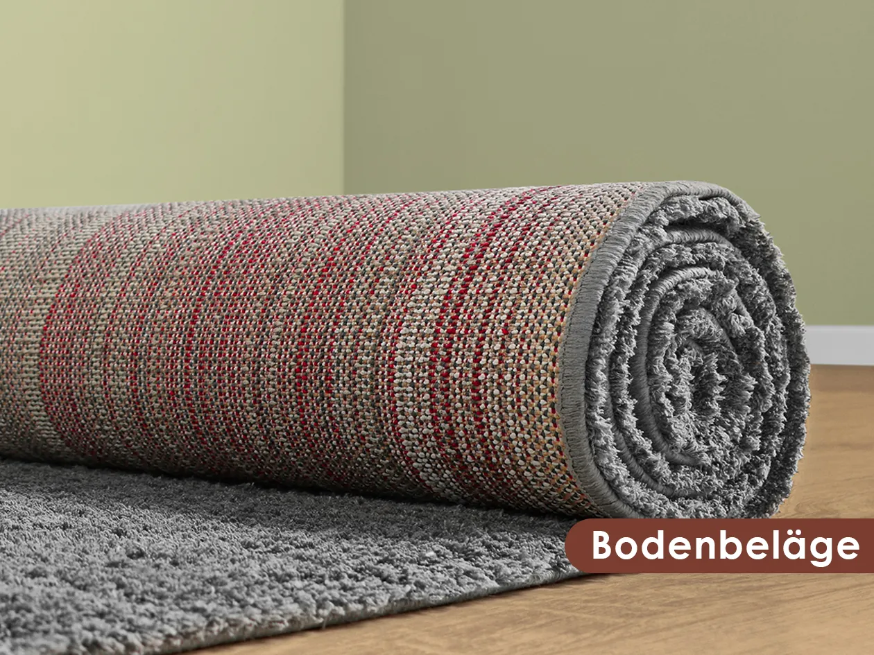 Gerollter Teppich als Beispiel für Bodenbeläge